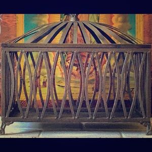 Wrought iron magazine holder, books